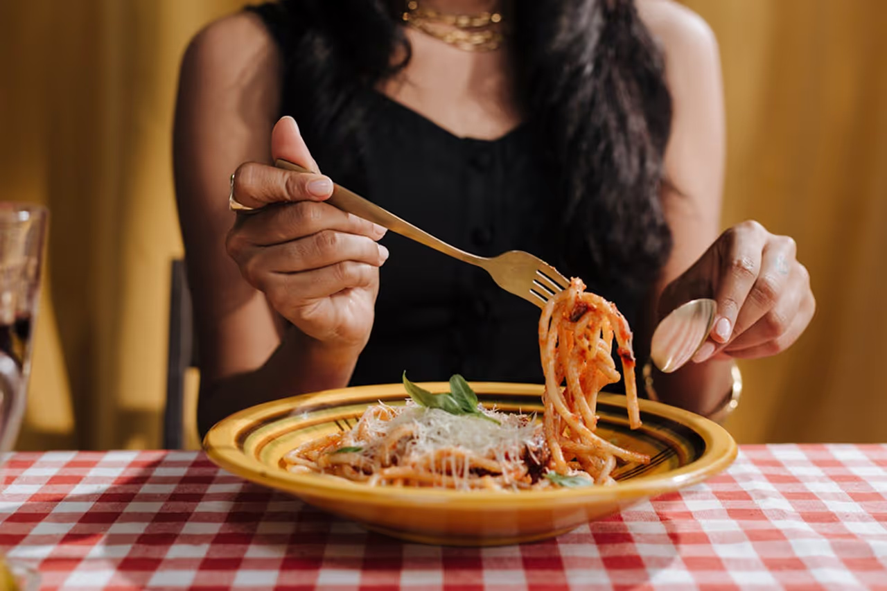 Pasta dish with tomato and cheese.